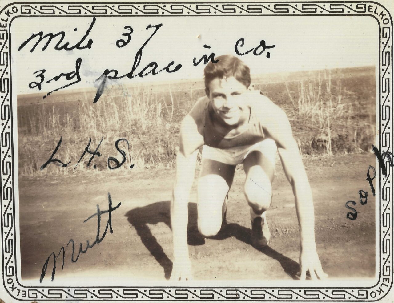1937 - William L. Garrison miler crouching